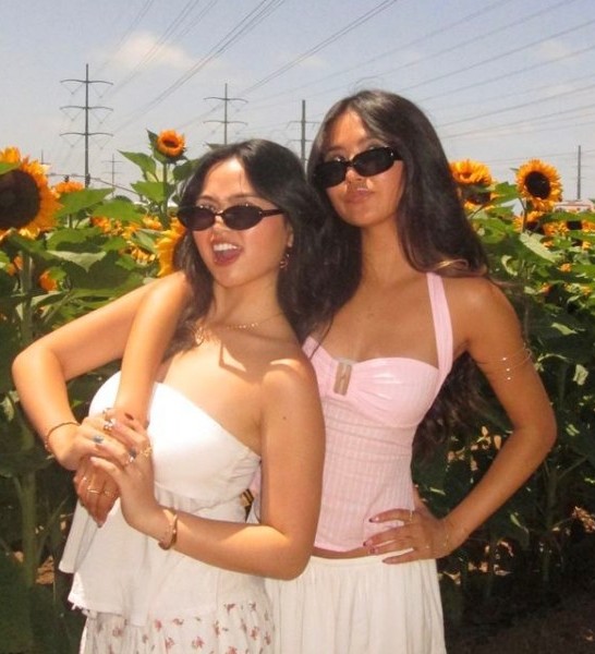 Two friends in a sunflower field, printed as a photo magnet